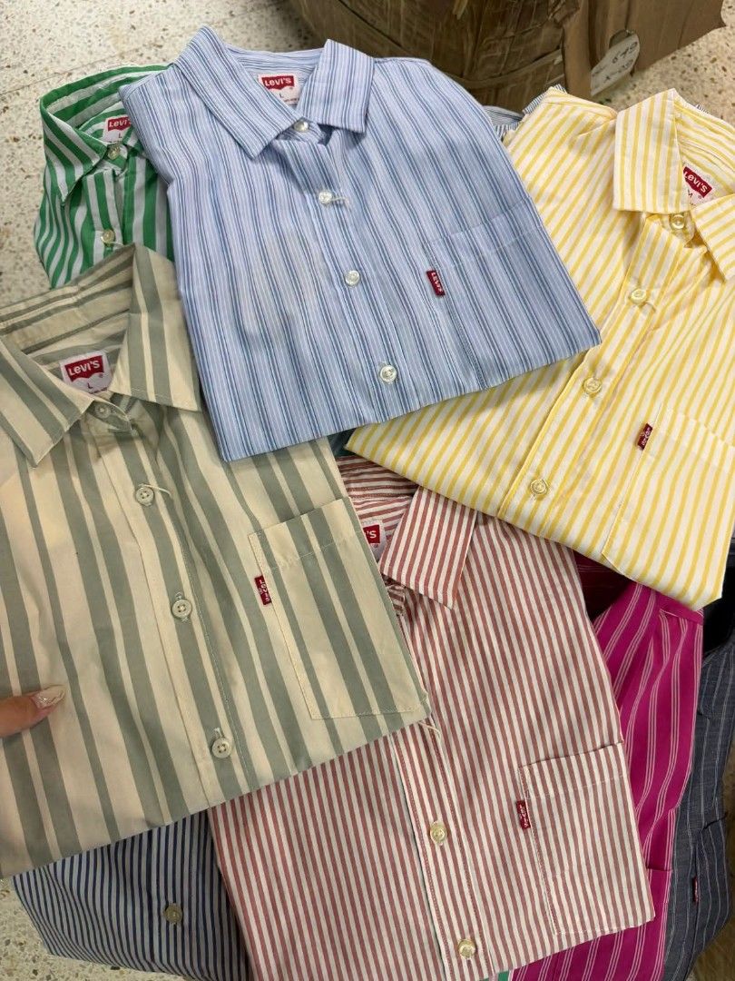 Levi's Striped Button-Up Shirts - Multiple Colors Available (Category: Shirts) located in Taguig. Submitted by chloe_clothingco. (Listing ID 1464390143, Image 1). Description: - Classic Levi's button-up shirts with extra button S-XL only - Features vertical stripes in various colorways - Chest pocket with iconic red Levi's tab - Versatile for casual or smart-casual outfits - Available in multiple sizes and colors.