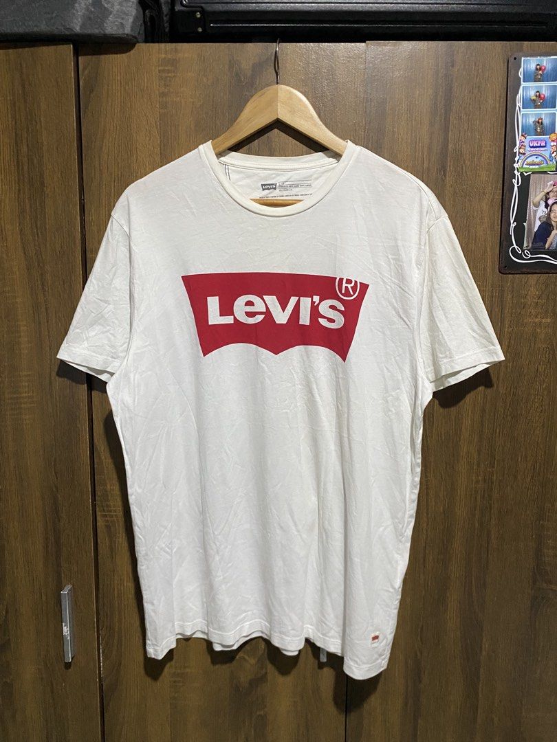 Levi's White T-Shirt with Red Logo (Category: Tshirts & Polo Shirts ) located in Antipolo. Submitted by cogiestamaria (Listing ID 1464378651, Image 1). Description: - Classic white Levi's t-shirt - size Large - dimes W22-L28 - no issue - color rate 9.5-10 - excellent condition - Features iconic red Batwing logo on the front - Standard fit - Made in Turkey - Versatile for casual outfits, pairs well with jeans or shorts - Essential wardrobe staple.