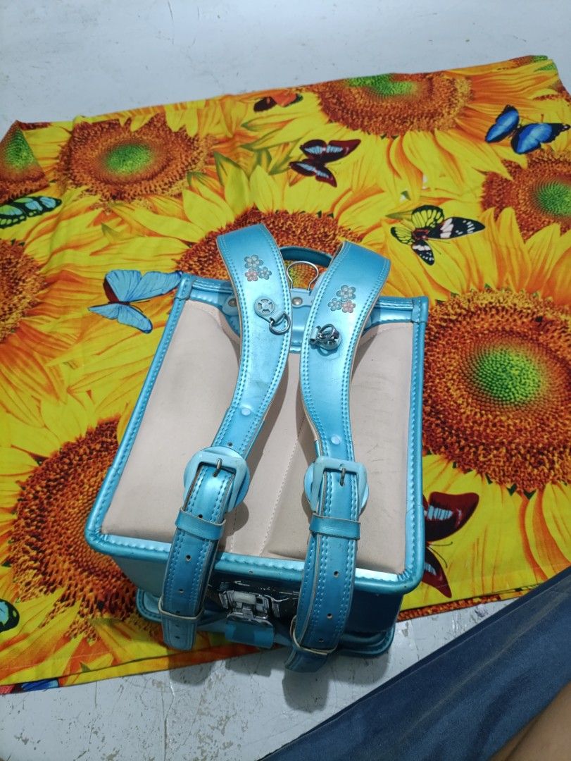 Light Blue Japanese Randoseru School Backpack (Category: Backpacks) located in Caloocan City. Submitted by parungaoai70385 (Listing ID 1464529789, Image 3). Description: - Cute light blue school backpack - Classic Japanese randoseru style - Main compartment and front zip pocket - Padded shoulder straps for comfort - Minor scuffs on exterior, good overall condition - Ideal for school or everyday use.