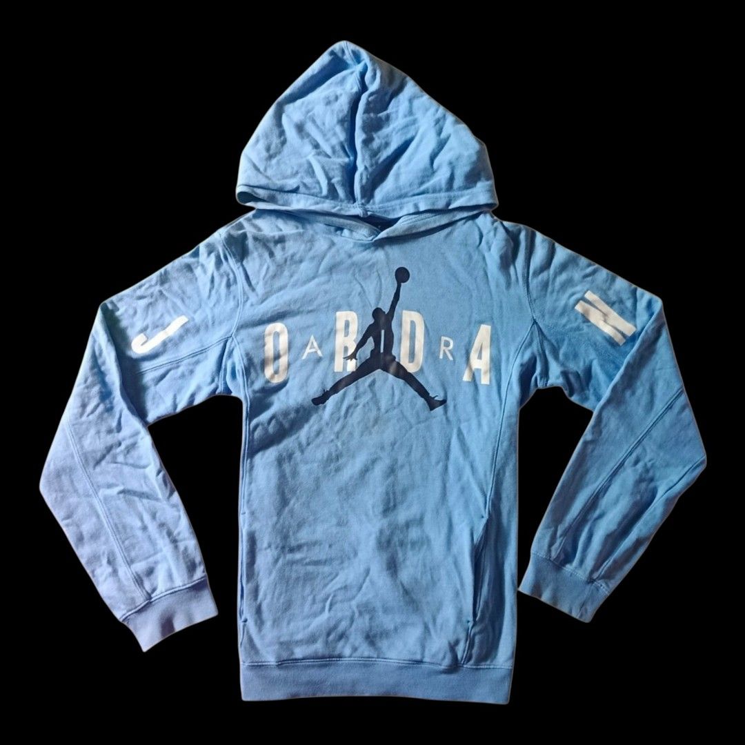 Light Blue Jordan Jumpman Hoodie (Category: Coats, Jackets and Outerwear) located in Manila. Submitted by puredragon.114381 (Listing ID 1464370030, Image 1). Description: - Light blue hoodie - Iconic Jordan Jumpman logo on front - 'JORDAN' text printed on front - Nike swoosh on left sleeve - Two white stripes on right sleeve - Hooded design - Long sleeves - Ideal for casual wear.