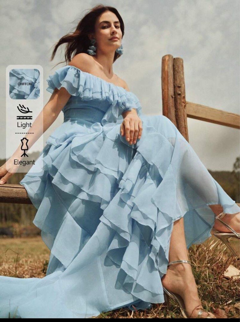 Light Blue Off-Shoulder Ruffle Chiffon Maxi Dress (Category: Dresses) located in Pasig City. Submitted by dairob1203 (Listing ID 1464445036, Image 2). Description: - Beautiful light blue off-shoulder maxi dress - Made of flowy chiffon with abundant ruffles - Perfect for special events, parties, or photoshoots - Size: Large (L) - Measurements: Bust 38.6 inches, Waist 33.1 inches, Length 48 inches - A stunning choice for your next occasion!.