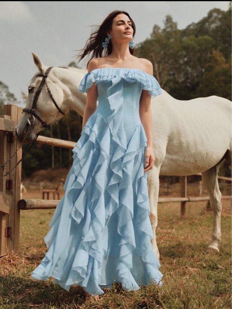 Light Blue Off-Shoulder Ruffle Chiffon Maxi Dress (Category: Dresses) located in Pasig City. Submitted by dairob1203 (Listing ID 1464445036, Image 1). Description: - Beautiful light blue off-shoulder maxi dress - Made of flowy chiffon with abundant ruffles - Perfect for special events, parties, or photoshoots - Size: Large (L) - Measurements: Bust 38.6 inches, Waist 33.1 inches, Length 48 inches - A stunning choice for your next occasion!.
