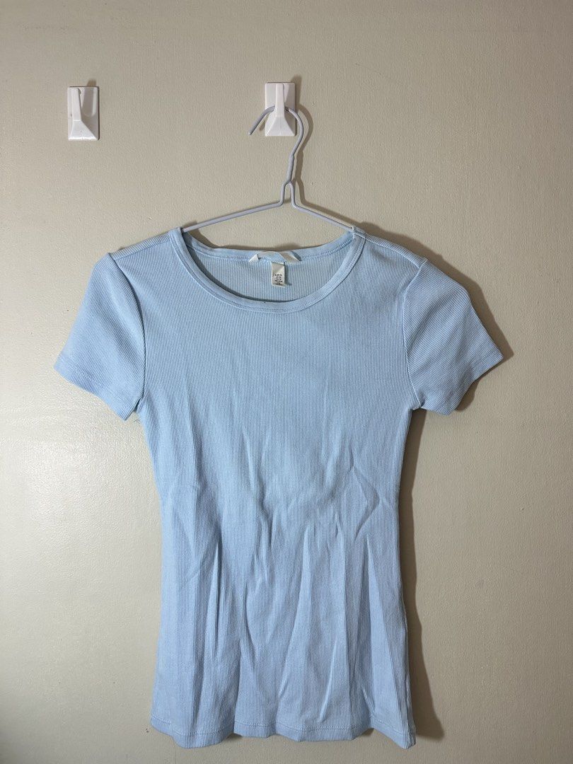 H&M Light Blue Ribbed T-shirt (Category: Shirts) located in Baguio. Submitted by archivedbyj (Listing ID 1464390353, Image 1). Description: - Light blue ribbed t-shirt - Short sleeves - Round neckline - Stretchy material - Fits like a size Small or Medium - Perfect wardrobe basic, easy to pair with anything.