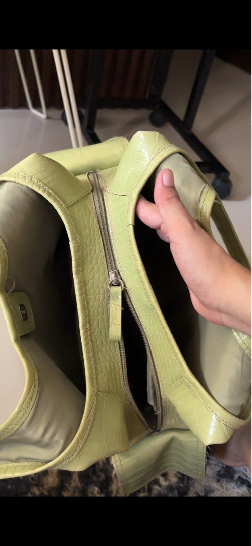 Light Green Croc Embossed Shoulder Bag (Category: Shoulder Bags) located in Manila. Submitted by guivslove04106 (Listing ID 1464392432, Image 3). Description: - Stylish light green shoulder bag - Elegant crocodile embossed texture - Secure zip closure - Note: Small hole and faint stain on exterior Location las pinas.