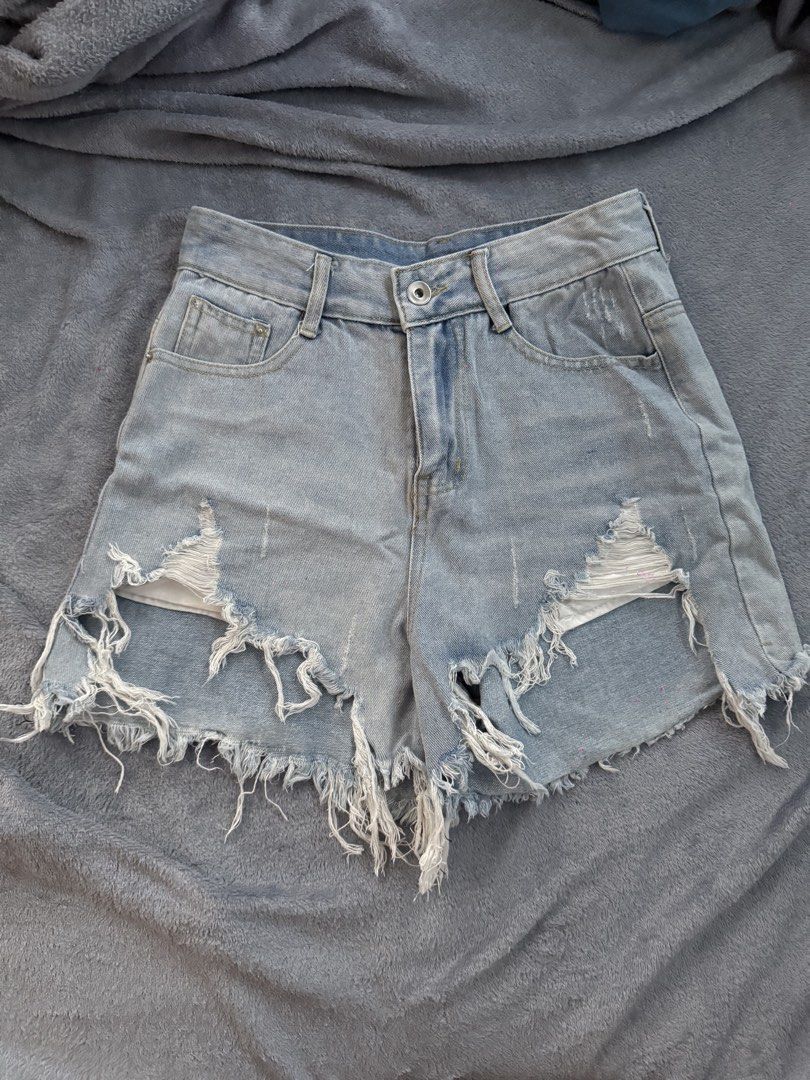 Light Wash Ripped Denim Shorts (Category: Shorts) located in Manila. Submitted by razshen_29 (Listing ID 1464486895, Image 1). Description: Waist: 25.2 inches Length: 14.6 inches - With free short (2nd Pic) - Super cute light wash denim shorts - High-waisted style - Distressed rips and frayed hem - Perfect for a casual summer look - Easy to style with t-shirts or crop tops.