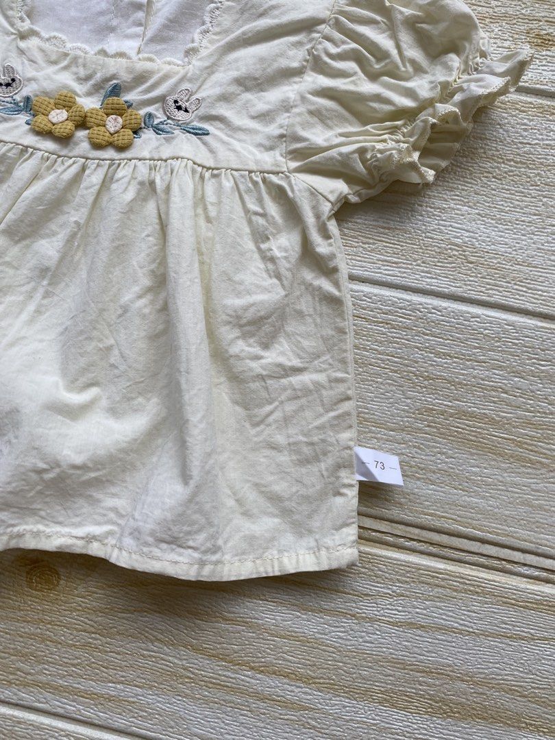 light yellow toddler top (Category: Babies & Kids Fashion) located in Cebu City. Submitted by yjainani (Listing ID 1464373087, Image 3). Description: featuring puff sleeves and embroidered flower and rabbit details on the chest fit 24m ( top only ).