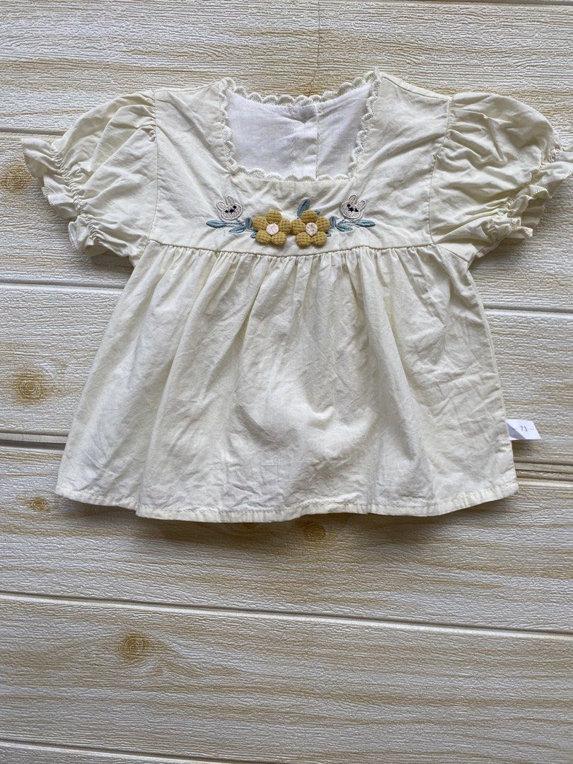 light yellow toddler top (Category: Babies & Kids Fashion) located in Cebu City. Submitted by yjainani (Listing ID 1464373087, Image 1). Description: featuring puff sleeves and embroidered flower and rabbit details on the chest fit 24m ( top only ).