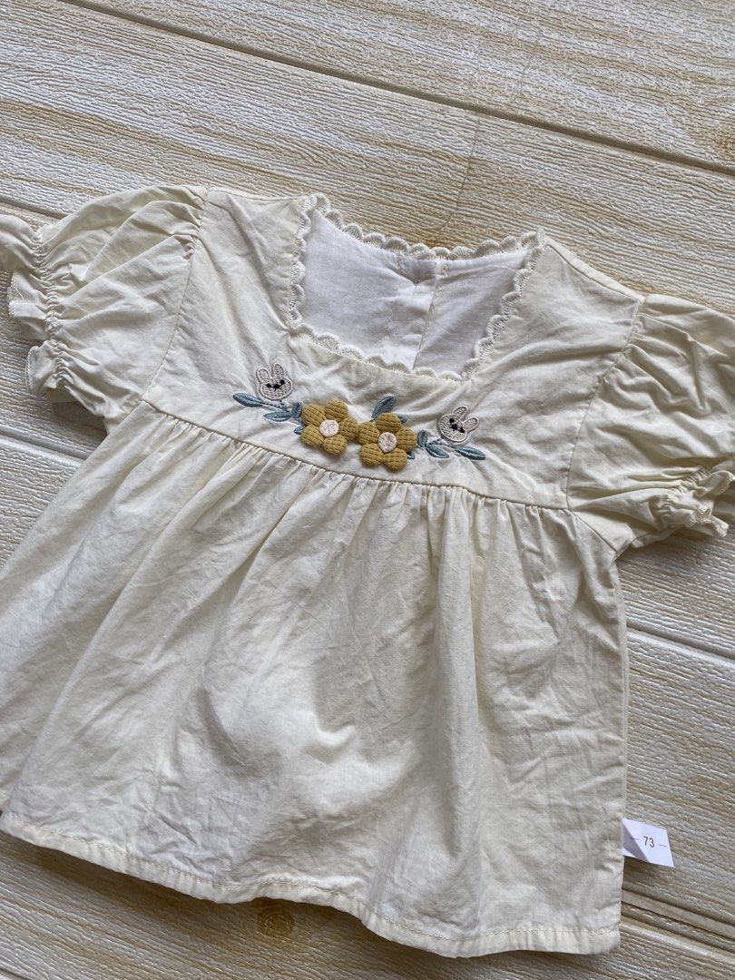 light yellow toddler top (Category: Babies & Kids Fashion) located in Cebu City. Submitted by yjainani (Listing ID 1464373087, Image 2). Description: featuring puff sleeves and embroidered flower and rabbit details on the chest fit 24m ( top only ).