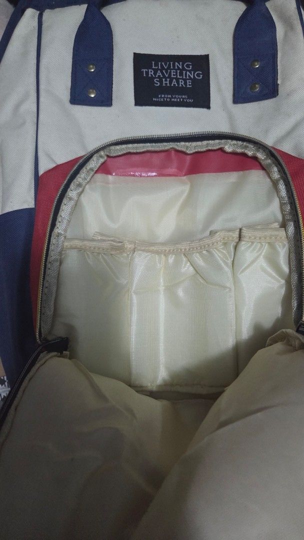 Living Traveling Share Backpack - Cream, Red, Navy (Category: Backpacks) located in Quezon City. Submitted by kctheexplorer05 (Listing ID 1464521176, Image 3). Description: - Stylish color block design (cream, red, navy) - Convenient front zip pocket - Multiple internal compartments for organization - Adjustable straps for a comfortable fit - Ideal for everyday use or travel adventures -visible stain (not sure if can wash it) and zipper lock in f