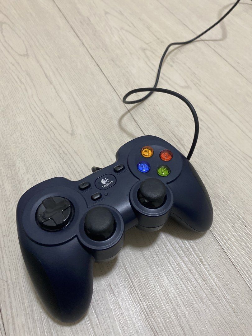 Logitech USB Game Controller (Category: Controllers) located in Singapore. Submitted by safepenguin_788ad3 (Listing ID 1464372010, Image 2). Description: - Logitech wired game controller - Connects via USB - Perfect for PC gaming - Responsive buttons and joysticks - Game-ready condition.