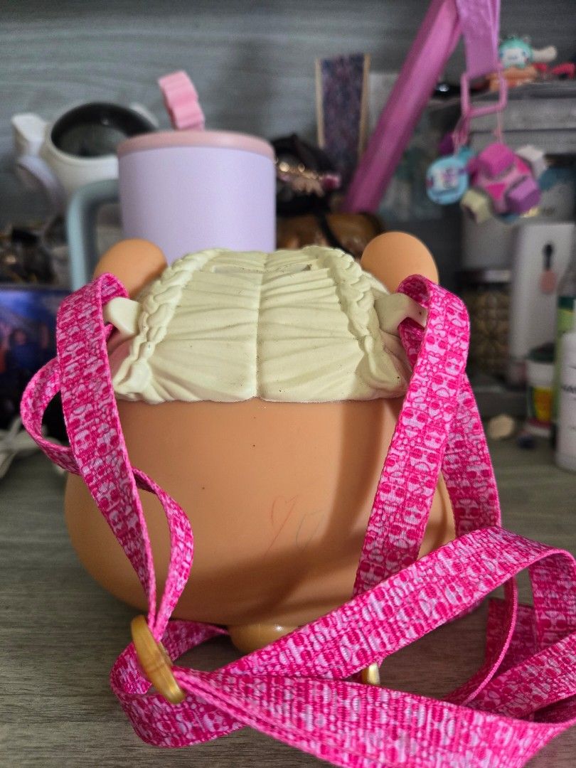 LOL Surprise Biggie Pets MC Hammy (Category: Kids Toys) located in Mangaldan. Submitted by jacqueline31426 (Listing ID 1464386970, Image 2). Description: - Adorable LOL Surprise Biggie Pets MC hammy - Features cute pink straps with a repeating pattern. - Includes a coin slot on the back for easy savings. - Ideal for kids to carry small essentials. - A must-have accessory for any LOL Surprise enthusiast..