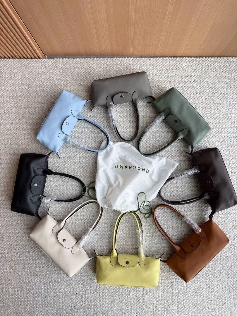 Long champ Le Pliage Shoulder Bag (Category: Luxury Bags & Wallets) located in Taguig. Submitted by chloe_clothingco. (Listing ID 1464391099, Image 1). Description: - Authentic Longchamp Le Pliage Cuir shoulder bags - Available Colors: Light Blue, Grey, Sage Green, Black, Cream, Yellow, Brown dark brown sold, and black sold - Includes original dust bag - Ideal for everyday use and travel.