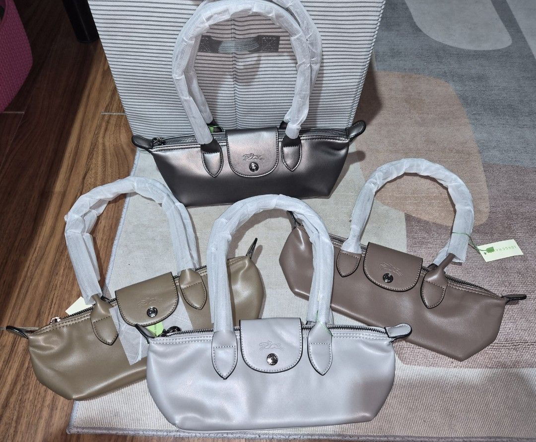 Long champ Le Pliage Shoulder Bag (Category: Luxury Bags & Wallets) located in Taguig. Submitted by chloe_clothingco. (Listing ID 1464391099, Image 3). Description: - Authentic Longchamp Le Pliage Cuir shoulder bags - Available Colors: Light Blue, Grey, Sage Green, Black, Cream, Yellow, Brown dark brown sold, and black sold - Includes original dust bag - Ideal for everyday use and travel.