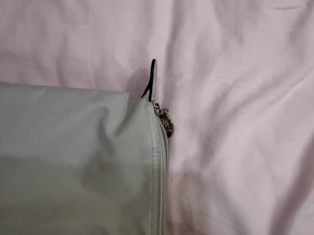 Longchamp Le Pliage Tote Bag Light Grey (Category: Luxury Bags & Wallets) located in Santa Rosa. Submitted by decluttering_. (Listing ID 1464468425, Image 2). Description: - AUTHENTIC Light grey Longchamp tote bag - Classic foldable design - Genuine leather handles and trim - Secure zipper closure with snap button flap - Spacious interior, ideal for everyday or travel.