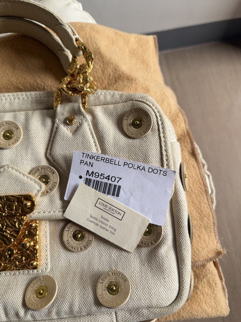 Louis Vuitton Limited Edition Tinkerbell Polka Dots (Category: Luxury Bags & Wallets) located in Bacoor. Submitted by mikaysu (Listing ID 1464475930, Image 3). Description: Rare limited-edition Louis Vuitton Tinker Bell Polka Dots bag featuring an ivory canvas body, playful gold-tone hardware, and the iconic Tinkerbell-inspired detailing. A highly collectible piece. Inclusion: Includes original tag and protective dust bag Condition: In excellent 