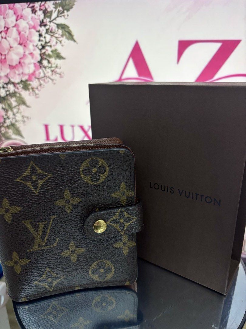 Louis Vuitton Monogram Canvas Zippy Compact Wallet (Category: Luxury Bags & Wallets) located in Mandaluyong City. Submitted by annaziki2001 (Listing ID 1464568436, Image 1). Description: - Authentic Louis Vuitton wallet - Classic Monogram canvas exterior - Rich brown leather interior - Multiple card slots for organization - Convenient zippered coin pocket - Includes original box and dust bag - Ideal for keeping your essentials tidy.