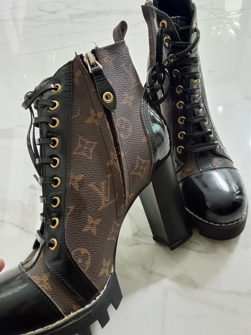 Louis Vuitton monogram combat boots (Category: Boots) located in Quezon City. Submitted by kema2191 (Listing ID 1464393215, Image 1). Description: Iconic Louis Vuitton monogram print - Black patent leather accents - Lace-up front with convenient side zipper - Trendy chunky platform heel - Expertly crafted in Italy - Please check photos for detailed condition.