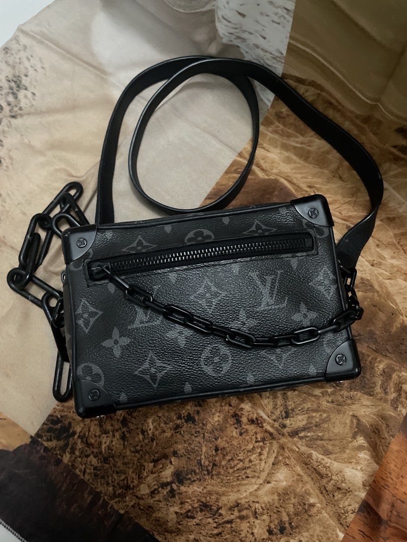 Louis Vuitton Monogram Trunk Bag Black (Category: Luxury Bags & Wallets) located in Cagayan de Oro. Submitted by luxieebags (Listing ID 1464547655, Image 1). Description: - Authentic Louis Vuitton trunk bag - Classic black monogram pattern - Versatile with both a black chain strap and a leather shoulder strap - Secure zipper closure on top - Small and compact size, ideal for carrying essentials.