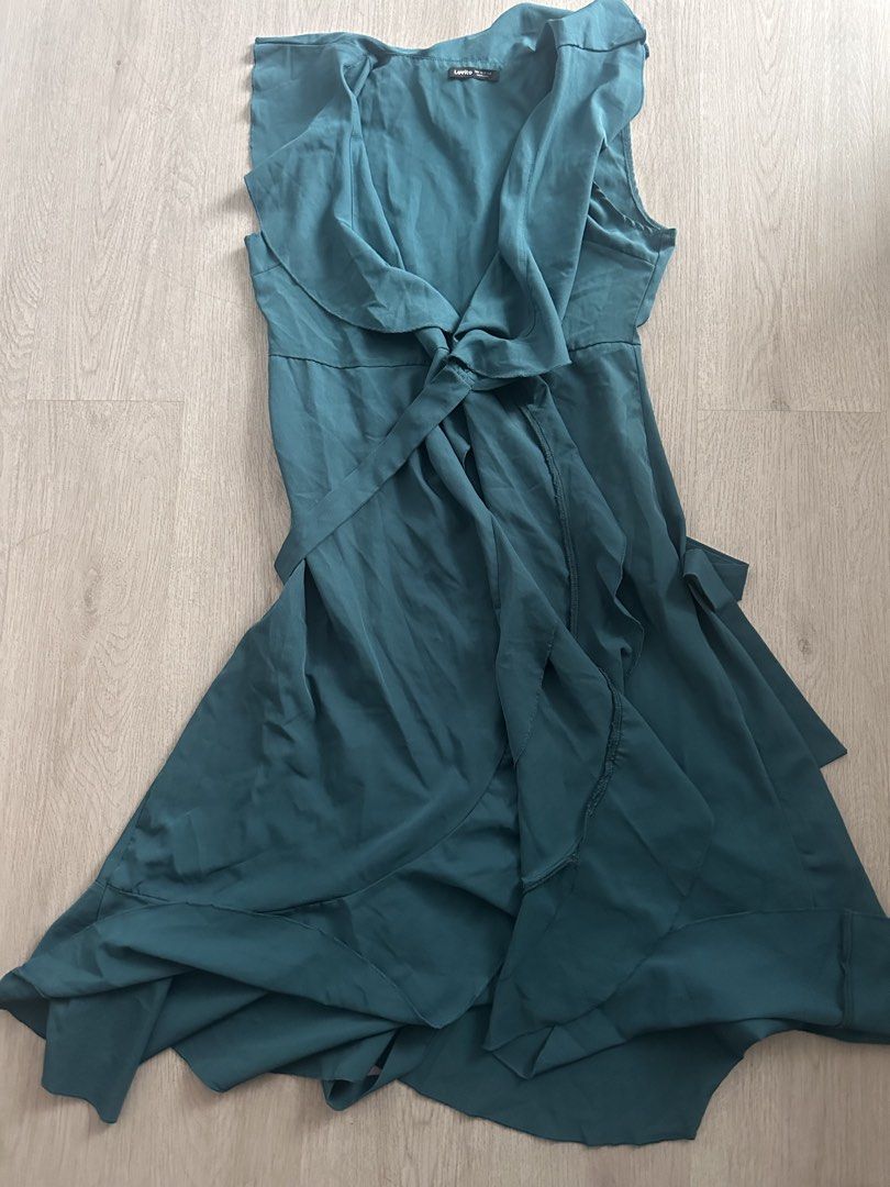 Lovito Teal Ruffle Wrap Midi Dress Size L (Category: Dresses) located in Makati City. Submitted by msjlarsen (Listing ID 1464462203, Image 1). Description: - Lovito Teal Midi Wrap Dress - used only once - Size: M to L - Model height 5’w - Style: Wrap with tie waist - Details: Ruffle neckline and hem, sleeveless - Occasion: Great for events or a night out/ beach summer wrap around .