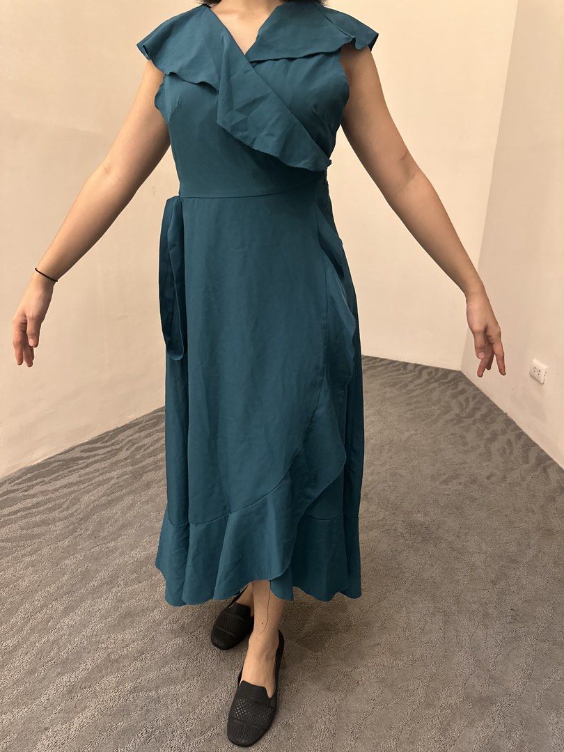 Lovito Teal Ruffle Wrap Midi Dress Size L (Category: Dresses) located in Makati City. Submitted by msjlarsen (Listing ID 1464462203, Image 3). Description: - Lovito Teal Midi Wrap Dress - used only once - Size: M to L - Model height 5’w - Style: Wrap with tie waist - Details: Ruffle neckline and hem, sleeveless - Occasion: Great for events or a night out/ beach summer wrap around .