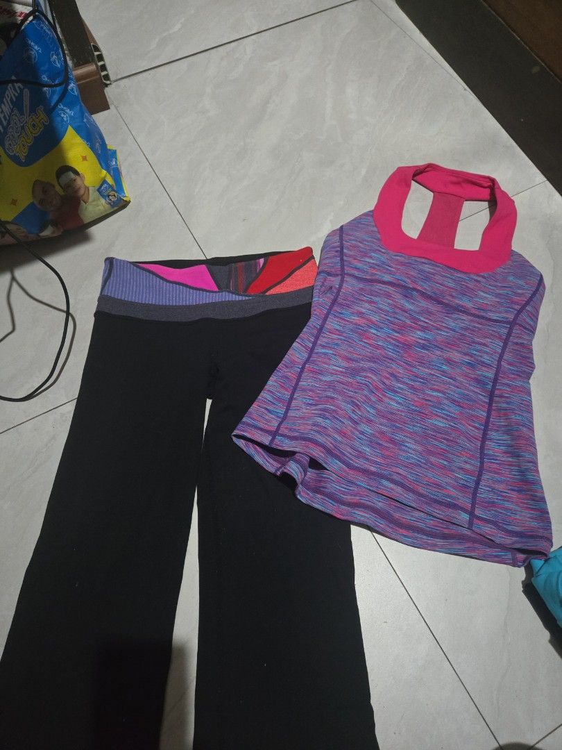 Authentic Lululemon Athletic Top and Leggings Set (Category: Activewear) located in Pasig City. Submitted by izzy0202 (Listing ID 1464395153, Image 1). Description: - Lululemon athletic top with a vibrant, colorful marled pattern. - Features a stylish pink racerback design. - Matching black leggings with a unique colorful waistband. - Both pieces display the iconic Lululemon logo. - Versatile for gym sessions or everyday casual wear. purchased in