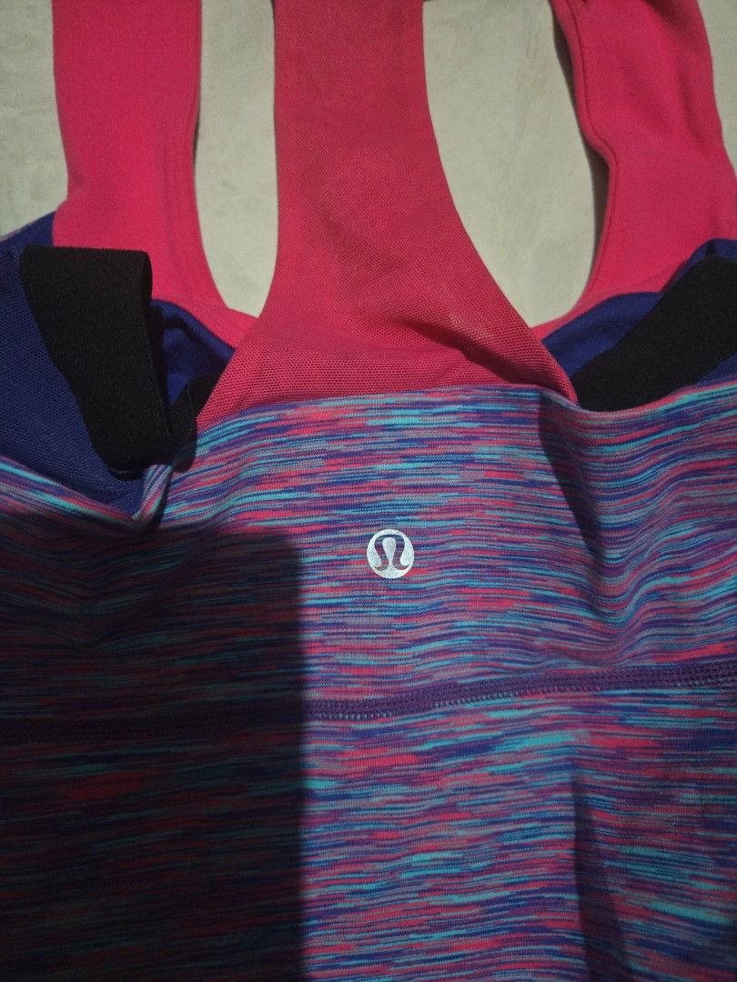 Authentic Lululemon Athletic Top and Leggings Set (Category: Activewear) located in Pasig City. Submitted by izzy0202 (Listing ID 1464395153, Image 3). Description: - Lululemon athletic top with a vibrant, colorful marled pattern. - Features a stylish pink racerback design. - Matching black leggings with a unique colorful waistband. - Both pieces display the iconic Lululemon logo. - Versatile for gym sessions or everyday casual wear. purchased in