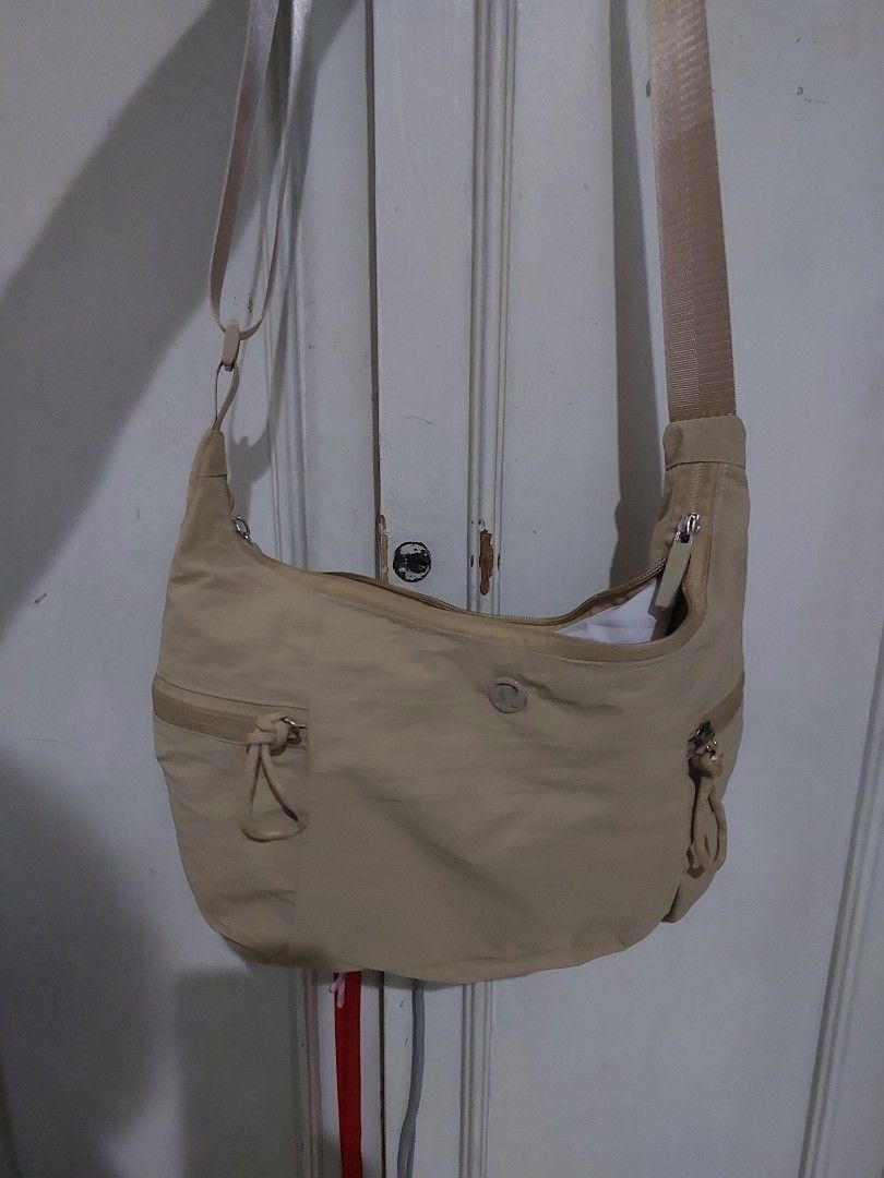 Lululemon Beige Slouchy Sling Bag 6L (Category: Cross-body Bags) located in Quezon City. Submitted by manilahaulph (Listing ID 1464552592, Image 3). Description: - Beige Lululemon sling bag - Main zip compartment - Front pocket - Adjustable strap - Clean inside and out - Ideal for everyday use.