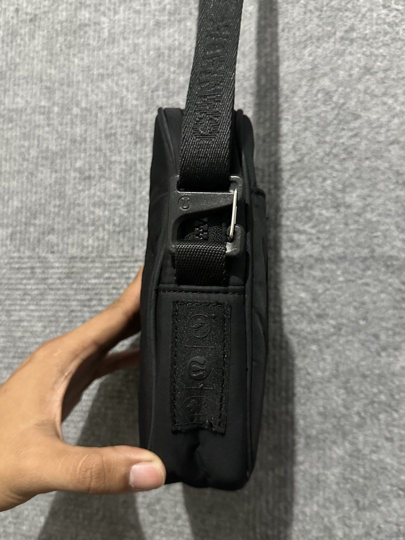 Lululemon Black Crossbody Bag with Canada Strap (Category: Cross-body Bags) located in Villasis. Submitted by justinramosonfb (Listing ID 1464469467, Image 1). Description: - Black Lululemon crossbody bag - Canada logo detail on the strap - Convenient front pocket - Secure main zippered compartment - Adjustable strap for a custom fit - Ideal for everyday errands or travel adventures.