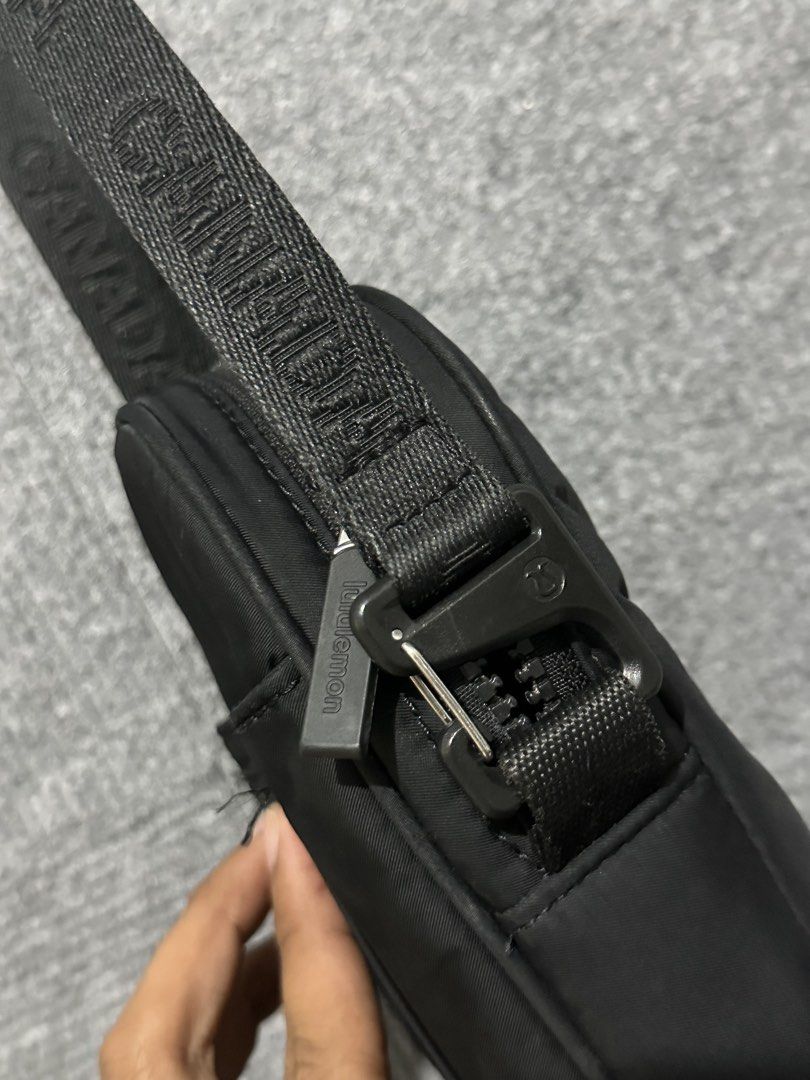 Lululemon Black Crossbody Bag with Canada Strap (Category: Cross-body Bags) located in Villasis. Submitted by justinramosonfb (Listing ID 1464469467, Image 3). Description: - Black Lululemon crossbody bag - Canada logo detail on the strap - Convenient front pocket - Secure main zippered compartment - Adjustable strap for a custom fit - Ideal for everyday errands or travel adventures.