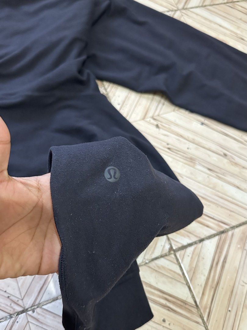 Lululemon Black Jogger Pants Size 6 (Category: Joggers) located in Angeles City. Submitted by alejeong27 (Listing ID 1464435355, Image 3). Description: - Black Lululemon joggers - Comfortable and stretchy material - Elastic waistband with adjustable drawstring - Cuffed ankles for a sleek look - Versatile: great for workouts or lounging - Features convenient pockets - Subtle Lululemon logo on back leg and inside waistband.