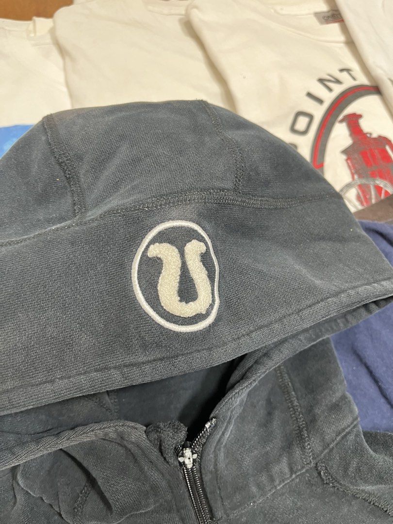 Lululemon Black Scuba Full Zip Hoodie (Category: Coats, Jackets and Outerwear) located in Baao. Submitted by plainclothesdept (Listing ID 1464533357, Image 3). Description: Lulúlemon Black Scuba Full Zip Hoodie width - 19 in. length - 21 in. major discoloration, faded - Grey Lululemon full zip hoodie - Lululemon logo detail on the hood - Shows some wear on the cuffs - Small tear present on the left cuff - Ideal for workouts or casual wear.