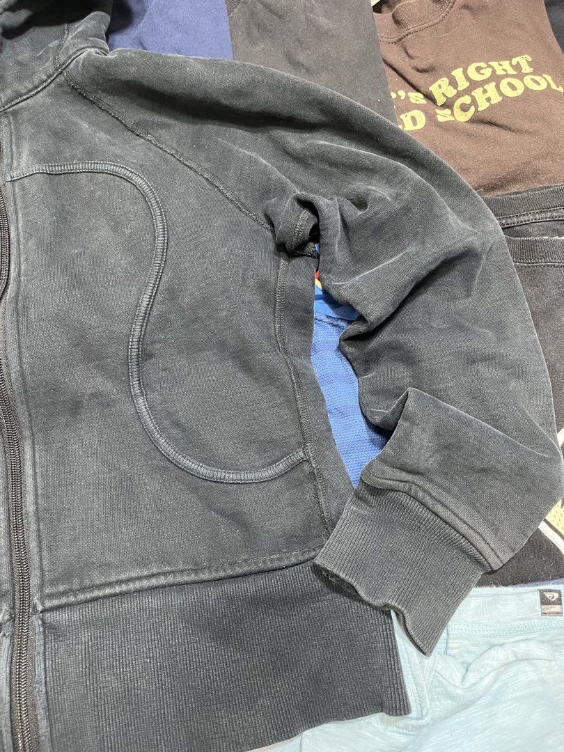 Lululemon Black Scuba Full Zip Hoodie (Category: Coats, Jackets and Outerwear) located in Baao. Submitted by plainclothesdept (Listing ID 1464533357, Image 2). Description: Lulúlemon Black Scuba Full Zip Hoodie width - 19 in. length - 21 in. major discoloration, faded - Grey Lululemon full zip hoodie - Lululemon logo detail on the hood - Shows some wear on the cuffs - Small tear present on the left cuff - Ideal for workouts or casual wear.