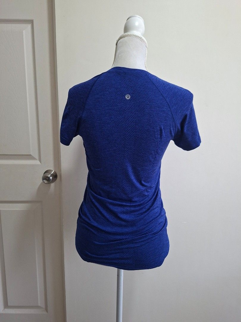 Lululemon Blue Running Top (Category: Activewear) located in Pasig City. Submitted by sporty.fit (Listing ID 1464492898, Image 3). Description: - Lightweight & breathable fabric - Stretchy and comfortable fit - Short sleeves - Lululemon logo at the back - Great for running, gym, golf, yoga, or everyday athleisure - For reference, mannequin dimensions are: Bust: 35" Waist: 27" Hips: 36".