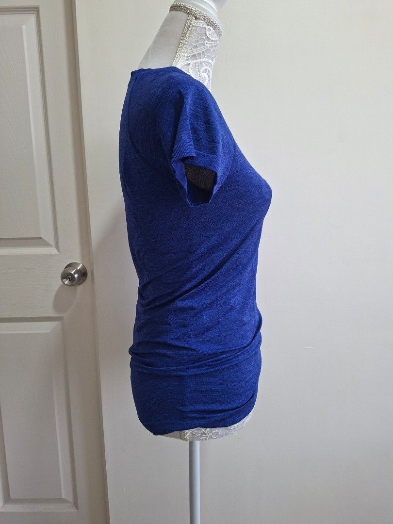 Lululemon Blue Running Top (Category: Activewear) located in Pasig City. Submitted by sporty.fit (Listing ID 1464492898, Image 2). Description: - Lightweight & breathable fabric - Stretchy and comfortable fit - Short sleeves - Lululemon logo at the back - Great for running, gym, golf, yoga, or everyday athleisure - For reference, mannequin dimensions are: Bust: 35" Waist: 27" Hips: 36".