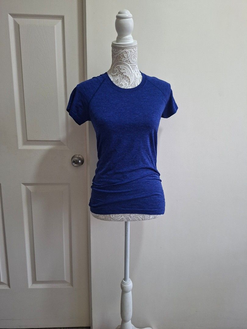 Lululemon Blue Running Top (Category: Activewear) located in Pasig City. Submitted by sporty.fit (Listing ID 1464492898, Image 1). Description: - Lightweight & breathable fabric - Stretchy and comfortable fit - Short sleeves - Lululemon logo at the back - Great for running, gym, golf, yoga, or everyday athleisure - For reference, mannequin dimensions are: Bust: 35" Waist: 27" Hips: 36".