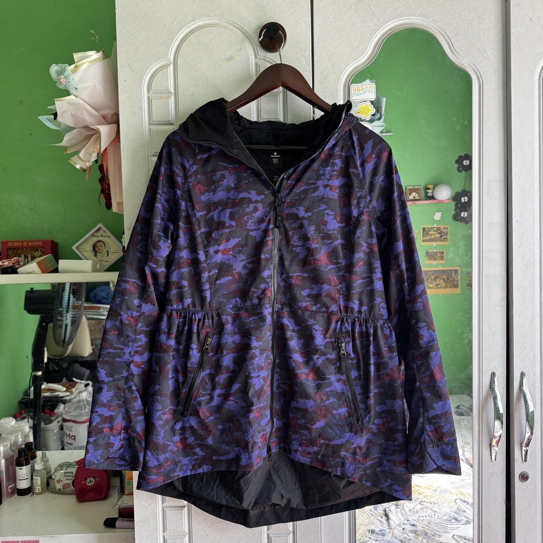 Lululemon Camo Rain For Daze Hooded Jacket (Category: Coats, Jackets and Outerwear) located in Manila. Submitted by zennyaur (Listing ID 1464395878, Image 1). Description: - Lululemon hooded jacket - Stylish purple and black camouflage print - Full zip-up front - Convenient pockets - Elasticated waist detail for a comfortable fit - Lightweight material, ideal for workouts or casual wear.