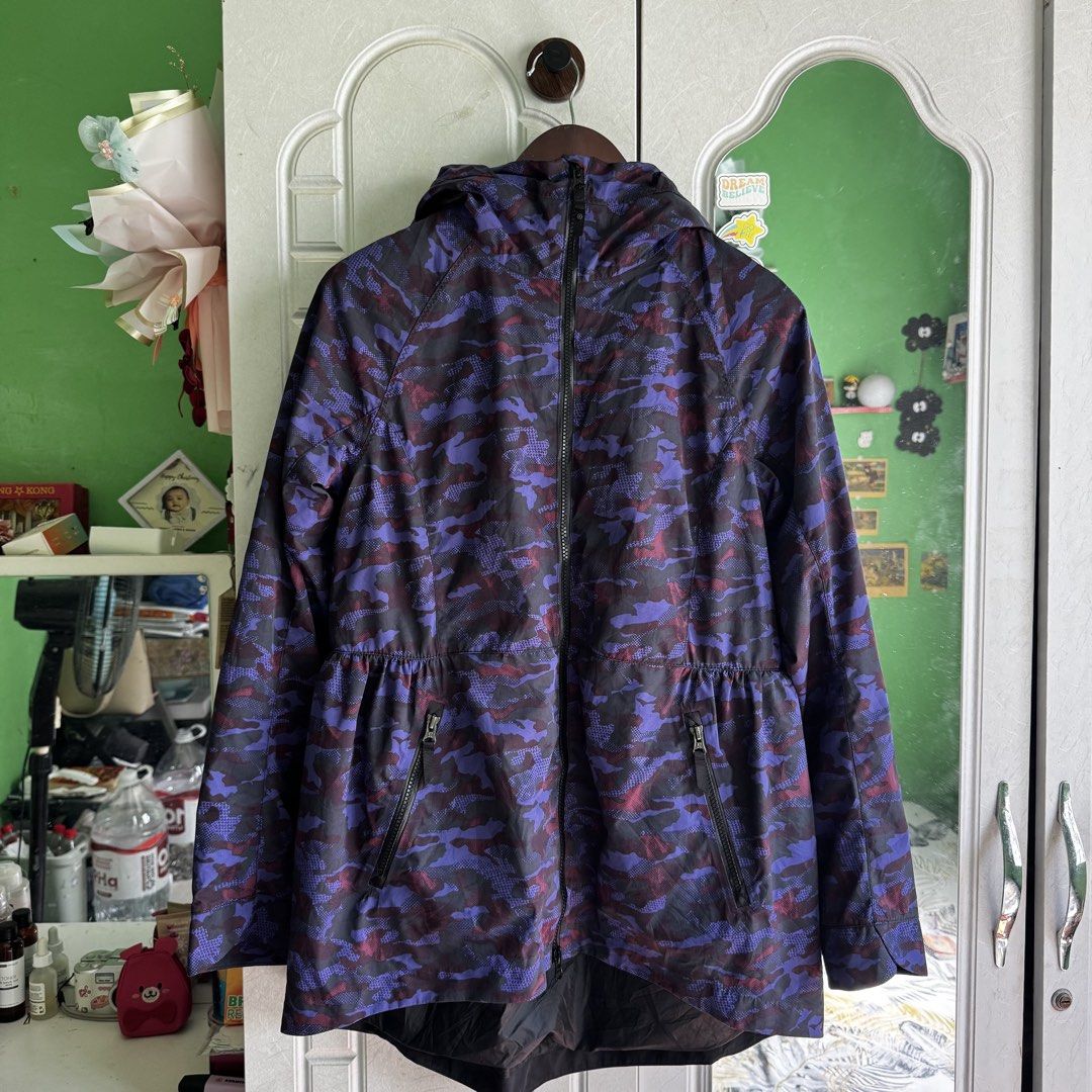 Lululemon Camo Rain For Daze Hooded Jacket (Category: Coats, Jackets and Outerwear) located in Manila. Submitted by zennyaur (Listing ID 1464395878, Image 2). Description: - Lululemon hooded jacket - Stylish purple and black camouflage print - Full zip-up front - Convenient pockets - Elasticated waist detail for a comfortable fit - Lightweight material, ideal for workouts or casual wear.