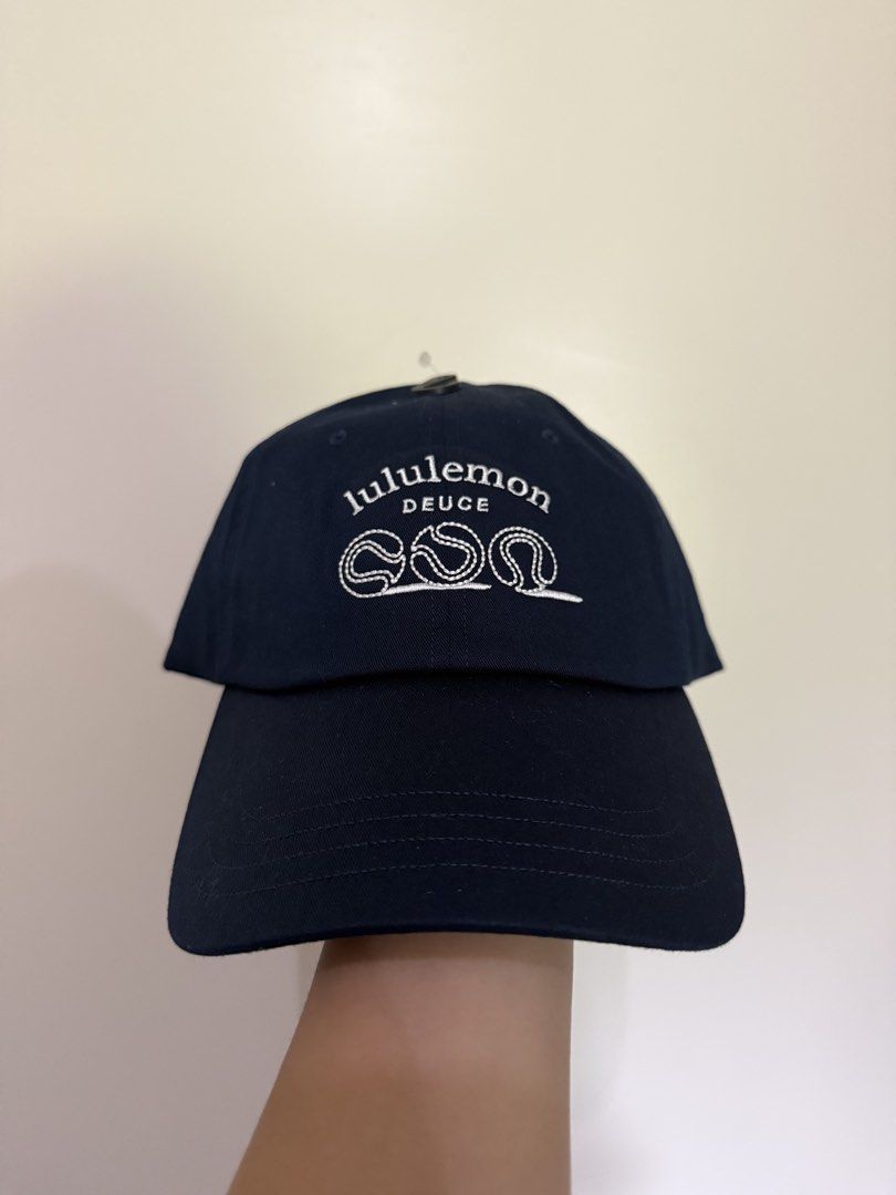 Lululemon Deuce Classic Ball Cap Navy Blue S/M (Category: Caps & Hats) located in Manila. Submitted by katsinlao (Listing ID 1464414619, Image 1). Description: Lululemon Cap Details: - Features 'Lululemon Deuce' embroidery and tennis ball graphics - Adjustable strap with silver buckle - Brand new with original tags attached - Purchased in Utah 🇺🇸 Mode of Payment: - Payment first policy - Gcash - Maya - GoTyme - COD (if lalamove) - Cash (if meet