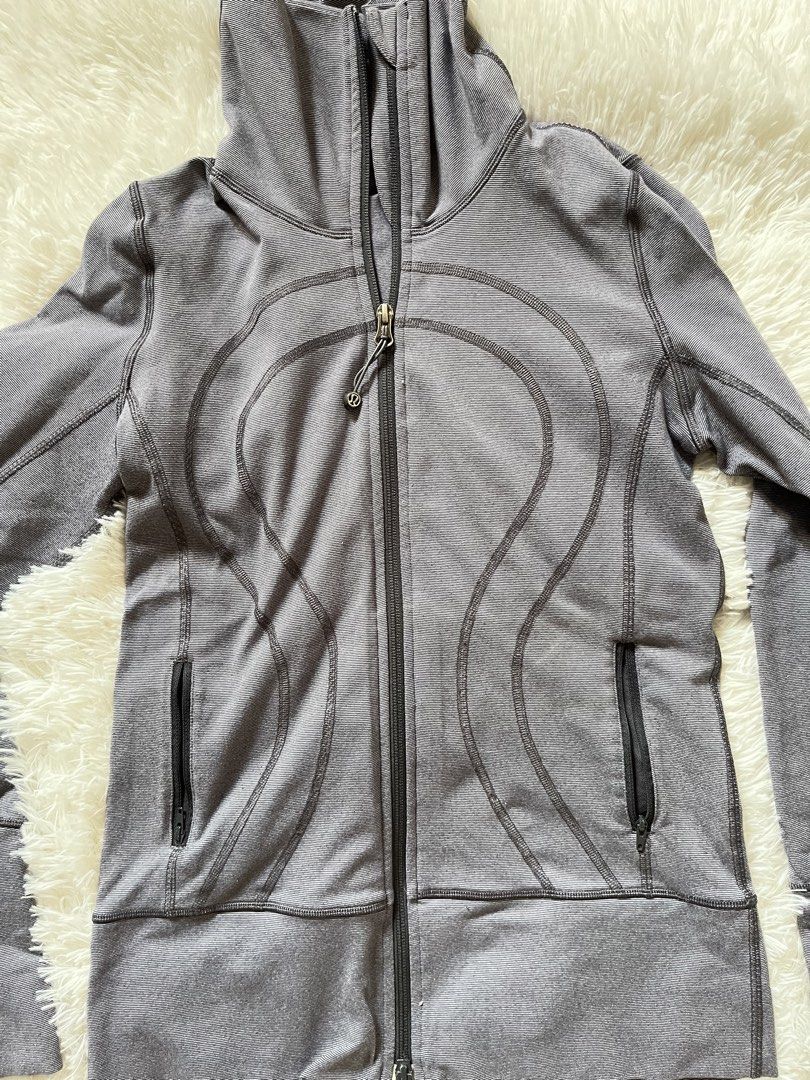 Lululemon Grey Zip-Up Jacket with Thumbholes (Category: Coats, Jackets and Outerwear) located in Valenzuela. Submitted by lovepatt (Listing ID 1464424629, Image 2). Description: - Grey Lululemon jacket - Full zip closure with high collar - Two zippered front pockets - Thumbholes on sleeves - Soft and stretchy material - Ideal for workouts or casual wear.