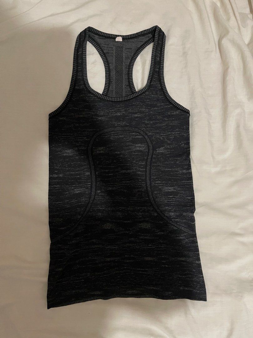 Lululemon Swiftly Tech Racerback Tank Top (Category: Activewear) located in Makati City. Submitted by afterpiece (Listing ID 1464478217, Image 1). Description: Lululemon Swiftly Tech Racerback tank in heathered black/grey. "Sweat Life" and "I Run For Cheese" Size 4, refer to photos for measurement.