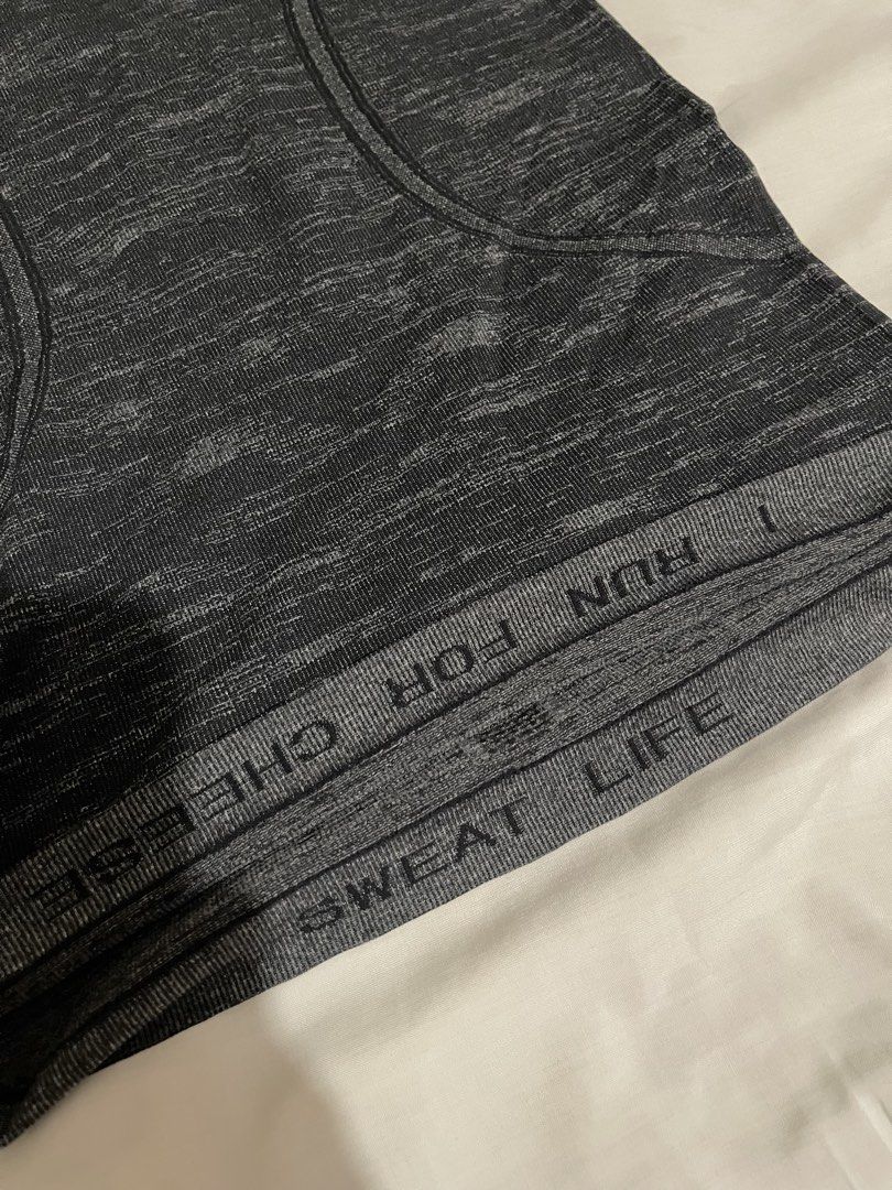 Lululemon Swiftly Tech Racerback Tank Top (Category: Activewear) located in Makati City. Submitted by afterpiece (Listing ID 1464478217, Image 3). Description: Lululemon Swiftly Tech Racerback tank in heathered black/grey. "Sweat Life" and "I Run For Cheese" Size 4, refer to photos for measurement.