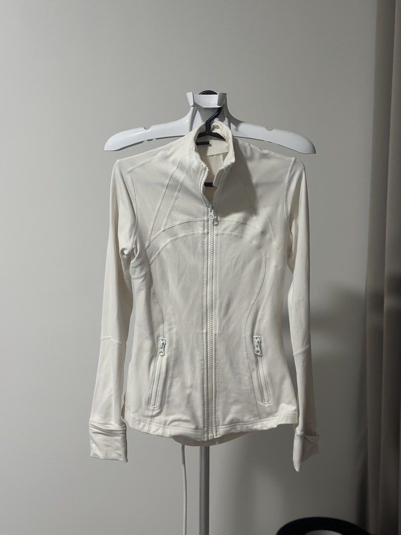 Lululemon White Jacket size 2 (Category: Coats, Jackets and Outerwear) located in Cavite. Submitted by prelovedbymaeve (Listing ID 1464451988, Image 1). Description: - White Lululemon jacket - Full zip closure - Two zip pockets - Thumbholes on sleeves.
