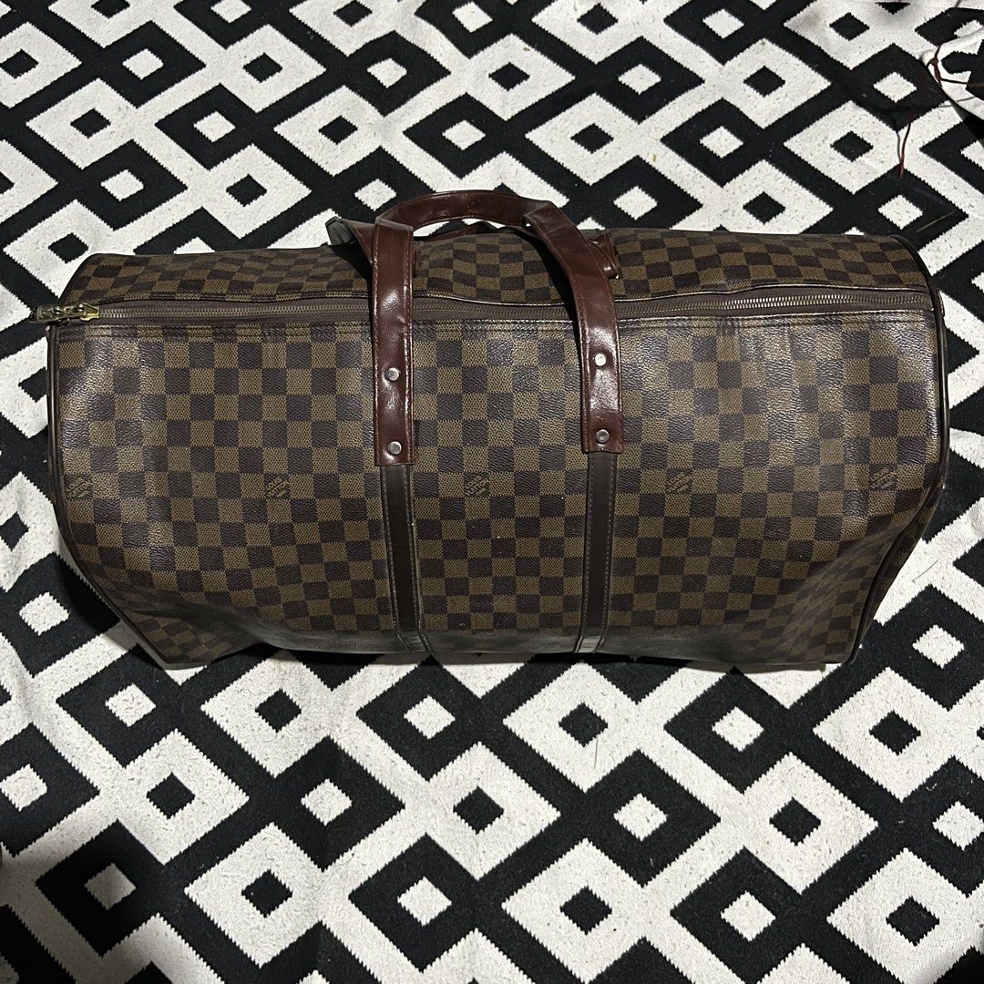 LV DUFFLE BAG (Big size) (Category: Luxury Bags & Wallets) located in Manila. Submitted by seven.stitch (Listing ID 1464410648, Image 3). Description: lv duffle bag no hard issue sa mismong bag replacement handle still good condition .
