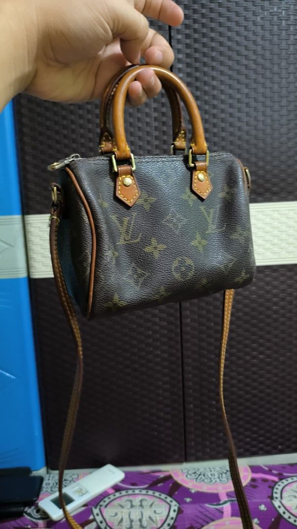 LV Mono Speedy Nano (Category: Cross-body Bags) located in Quezon City. Submitted by 88bagelya_ni_rhen88 (Listing ID 1464434677, Image 2). Description: - vintage Speedy Nano bag - Classic Monogram Canvas design - Genuine leather handles and strap - Secure zipper closure - Brown fabric interior - Date code: SR1233 - Ideal for carrying essentials - Small and compact size - preloved from japan .