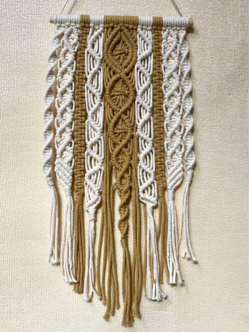 RUSH SALE Macrame Wall Hang (Category: Wall Decor) located in Caloocan City. Submitted by wearprelovedmnl (Listing ID 1464566345, Image 1). Description: Macrame Wall Hang W 7” H 11” Color: Toasted Almond, Cream Buyer handles SF.