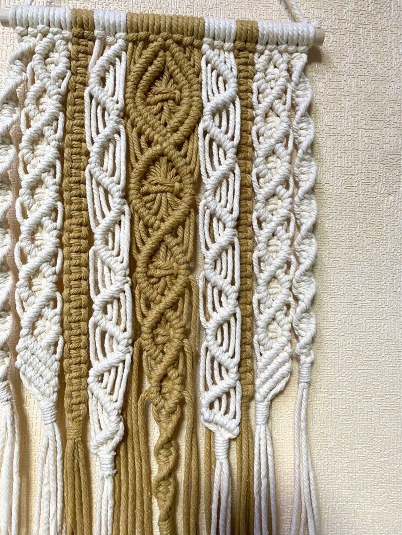 RUSH SALE Macrame Wall Hang (Category: Wall Decor) located in Caloocan City. Submitted by wearprelovedmnl (Listing ID 1464566345, Image 2). Description: Macrame Wall Hang W 7” H 11” Color: Toasted Almond, Cream Buyer handles SF.