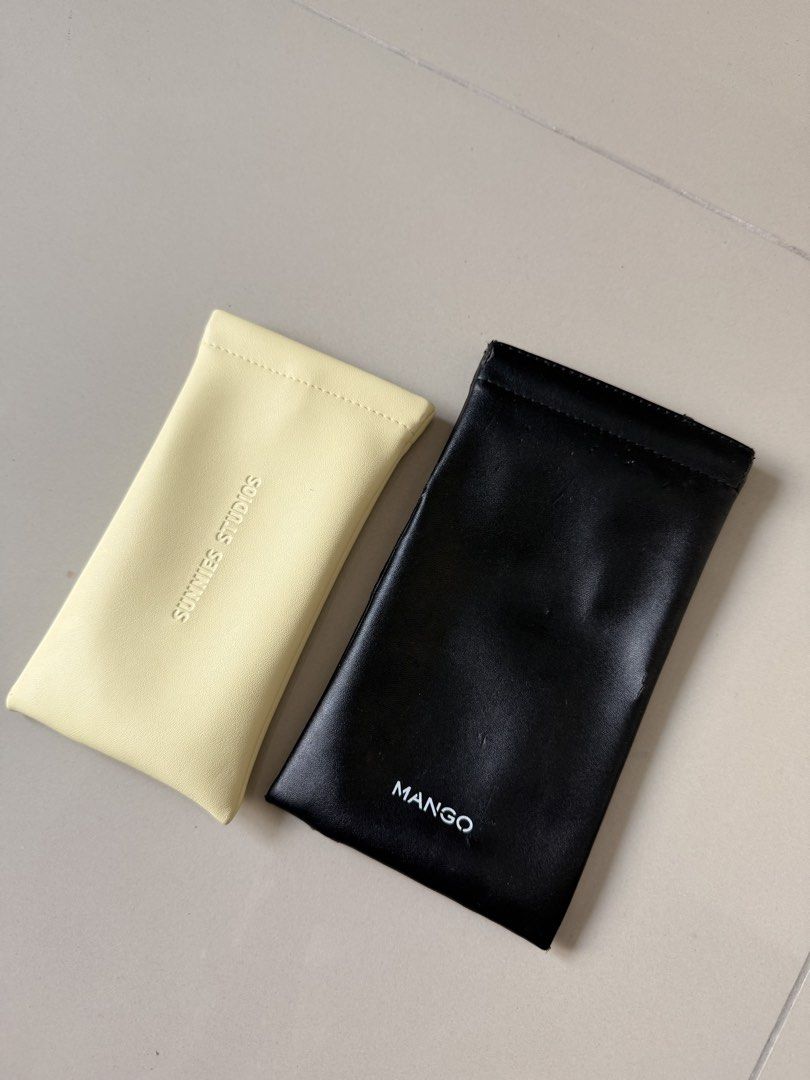 Mango and Sunnies Studios Pouches (Category: Purses & Pouches) located in Taguig. Submitted by marikinaa (Listing ID 1464501295, Image 1). Description: - Set of 2 pouches - 1 black pouch with Mango logo - 1 light yellow pouch with 'SUNNIES STUDIOS' embossed - Ideal for storing glasses or small accessories - Price is for both pouches .