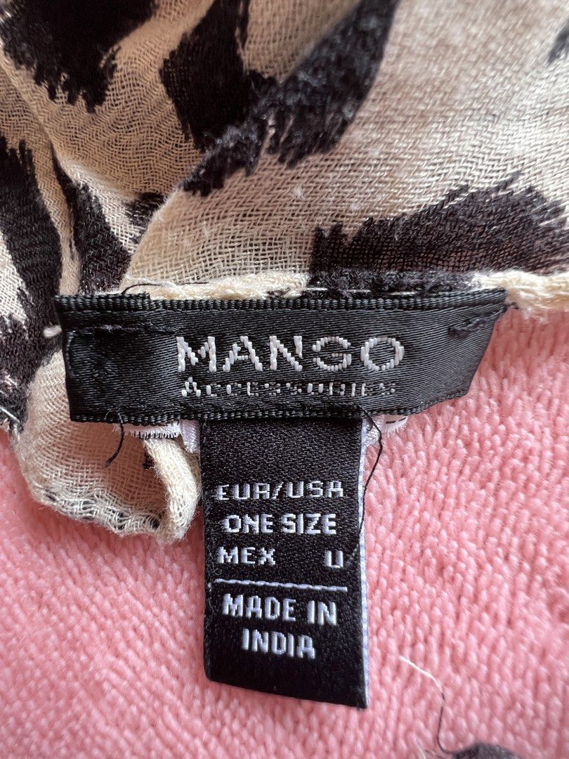 Mango Leopard Print Scarf (Category: Scarves) located in Batangas. Submitted by alaisaampa7513 (Listing ID 1464570036, Image 2). Description: - Lightweight scarf - Classic black and white leopard print - One size fits all - Made in India - Versatile accessory to elevate any outfit.
