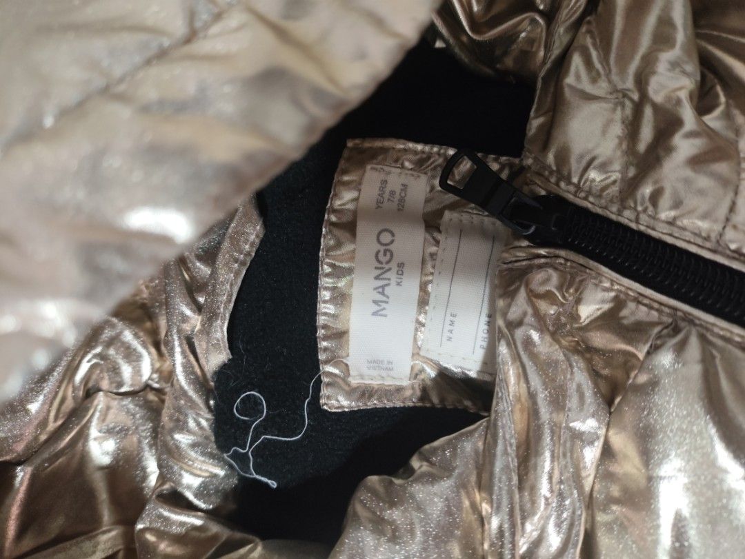 Mango metallic puffer jacket for kids (Category: Babies & Kids Fashion) located in Taguig. Submitted by scented_me21 (Listing ID 1464504854, Image 2). Description: Mango puffer jacket still puffy very minor usual fading for metallic materials.