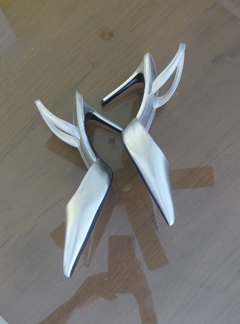 💯Mango Silver Slingback Heels Size 37 (Category: Heels) located in Mandaluyong City. Submitted by arlene2560 (Listing ID 1464399017, Image 2). Description: 💯 New, unused MANGO SILVER SLINGBACK. Size 37, fits a 38 or 9.6" insole measurements. Decluttering P1200. Mandaluyong Brand: Mango - Color: Silver - Style: Slingback Heels - Toe: Pointed - Heel: Thin - Features: Adjustable back strap - Size: 37 - Perfect for dressing up any outfit.